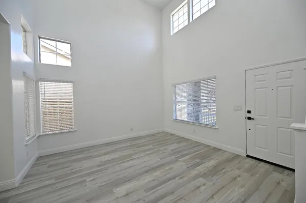 a kitchen with a refrigerator a sink and cabinets