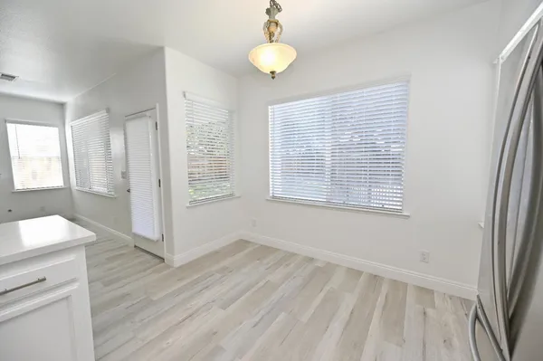 a living room with a fireplace and a window