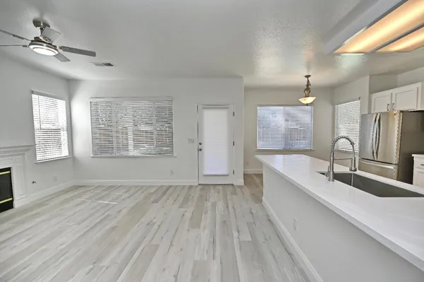 a bathroom with a double vanity sink a mirror and a bathtub