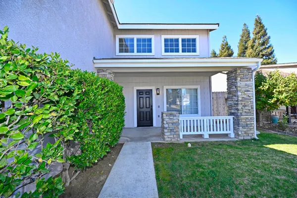 front view of a house with a yard