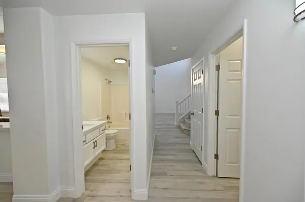 a bathroom with a sink vanity and a mirror