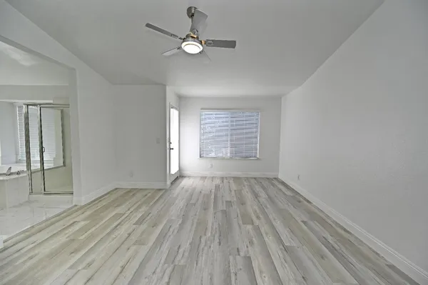 a view of a house with a yard and sitting area