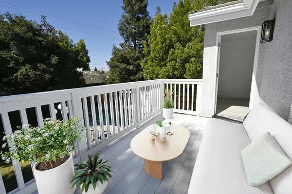 a view of a chair and table of the house