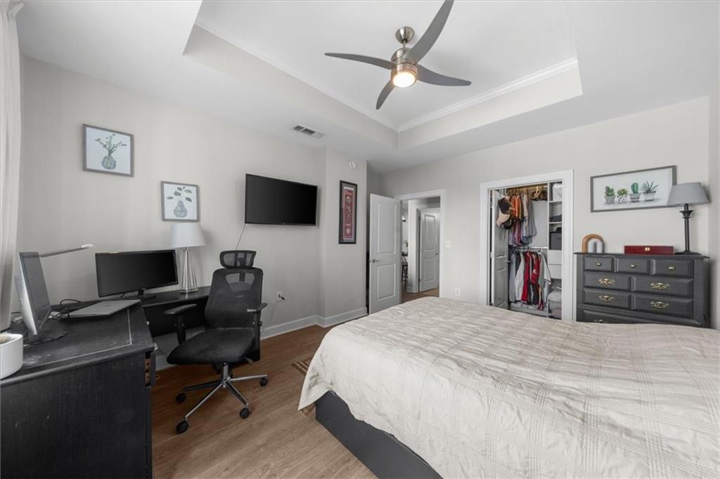 325 East Paces Ferry Road Northeast, Unit 504 Atlanta, GA 30305 - Photo 17 of 45 a bed room with a bed and a flat screen tv