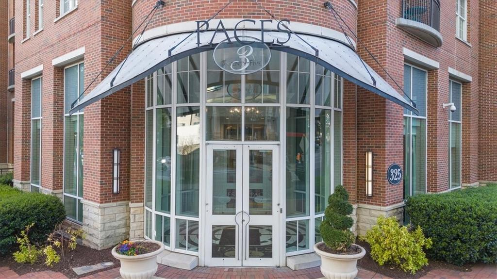 325 East Paces Ferry Road Northeast, Unit 504 Atlanta, GA 30305 - Photo 2 of 45 a front view of a house with plants