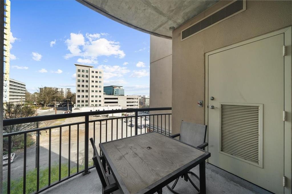325 East Paces Ferry Road Northeast, Unit 504 Atlanta, GA 30305 - Photo 22 of 45 a view of a balcony with furniture