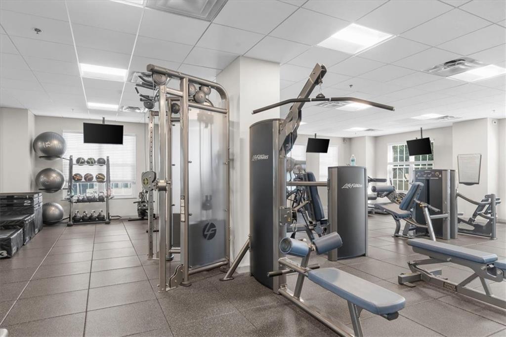 325 East Paces Ferry Road Northeast, Unit 504 Atlanta, GA 30305 - Photo 30 of 45 a view of a room with gym equipment