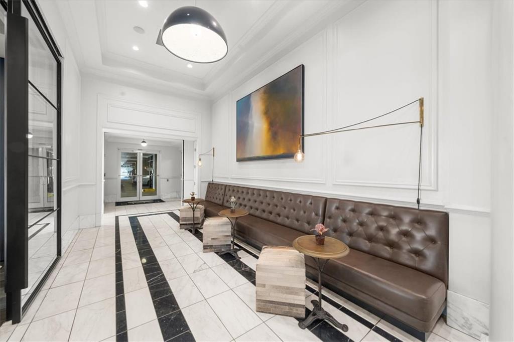 325 East Paces Ferry Road Northeast, Unit 504 Atlanta, GA 30305 - Photo 38 of 45 a living room with furniture and a rug