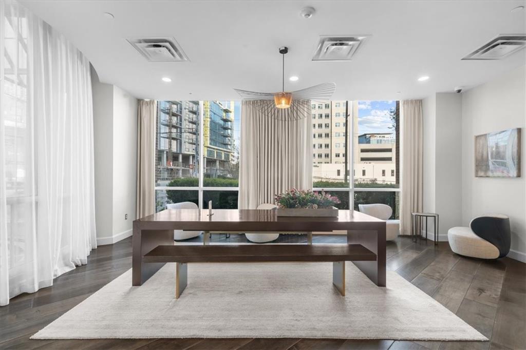 325 East Paces Ferry Road Northeast, Unit 504 Atlanta, GA 30305 - Photo 39 of 45 a living room with furniture and a large window