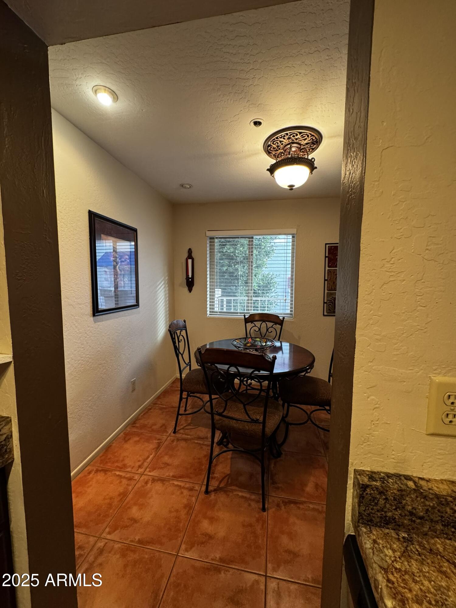 12123 West Bell Road, Unit 337 Surprise, AZ 85378 - Photo 12 of 50 a workspace with furniture and window