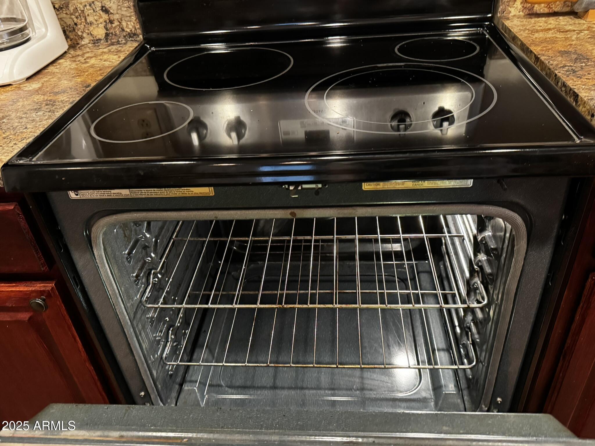 12123 West Bell Road, Unit 337 Surprise, AZ 85378 - Photo 15 of 50 a close view of stove and microwave