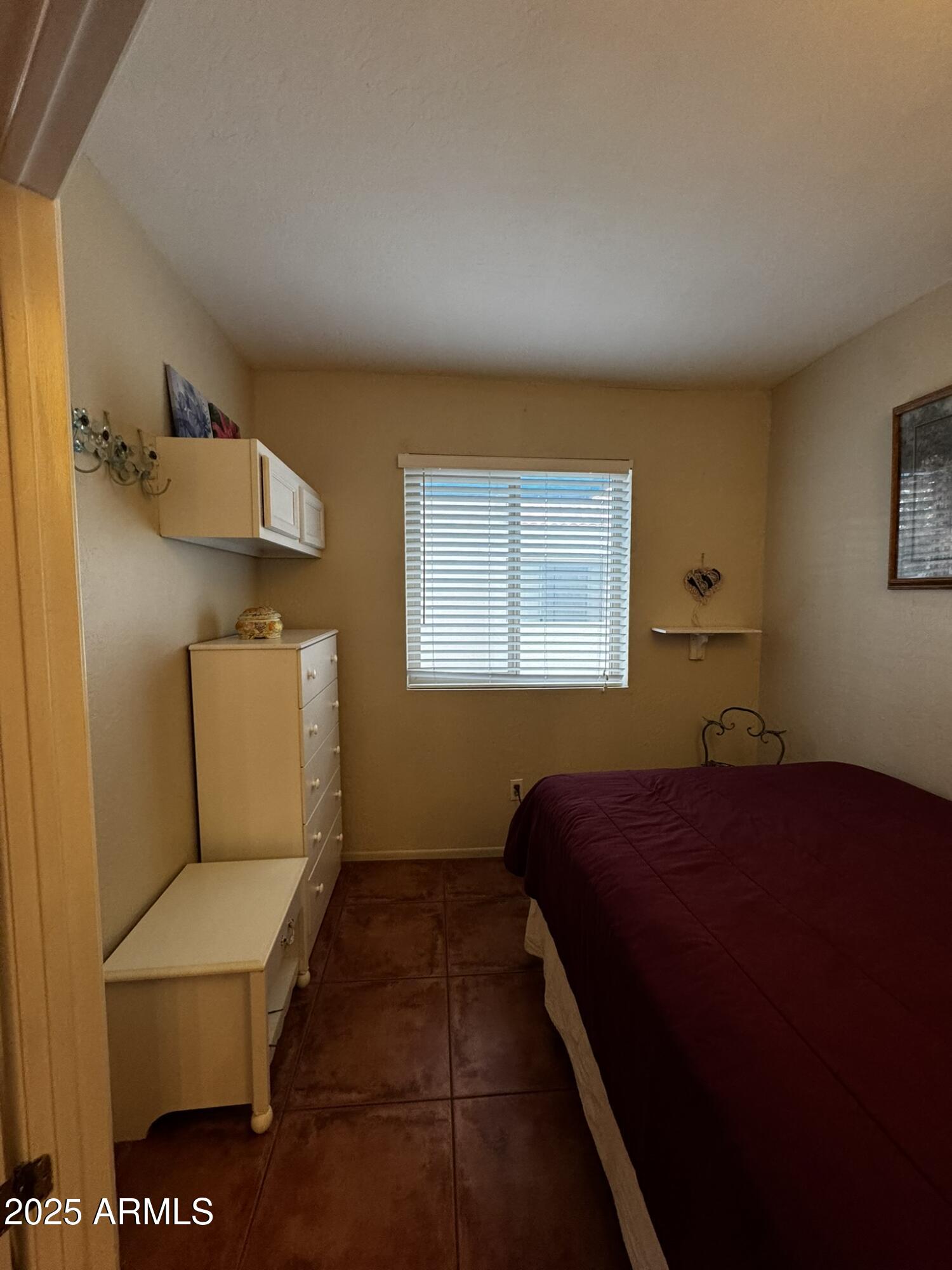12123 West Bell Road, Unit 337 Surprise, AZ 85378 - Photo 19 of 50 a bedroom with a bed and window