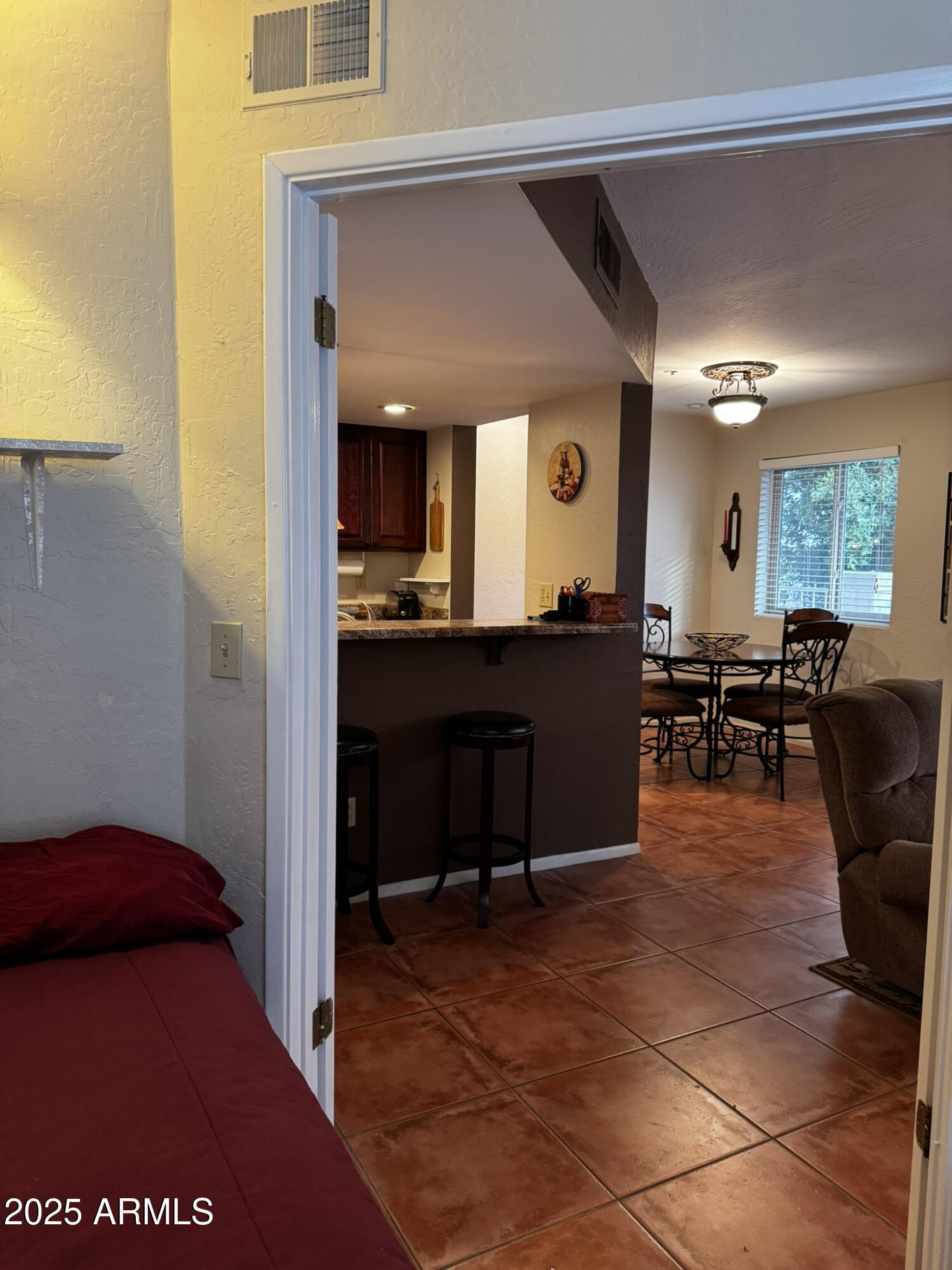 12123 West Bell Road, Unit 337 Surprise, AZ 85378 - Photo 21 of 50 a view of a living room and dining room