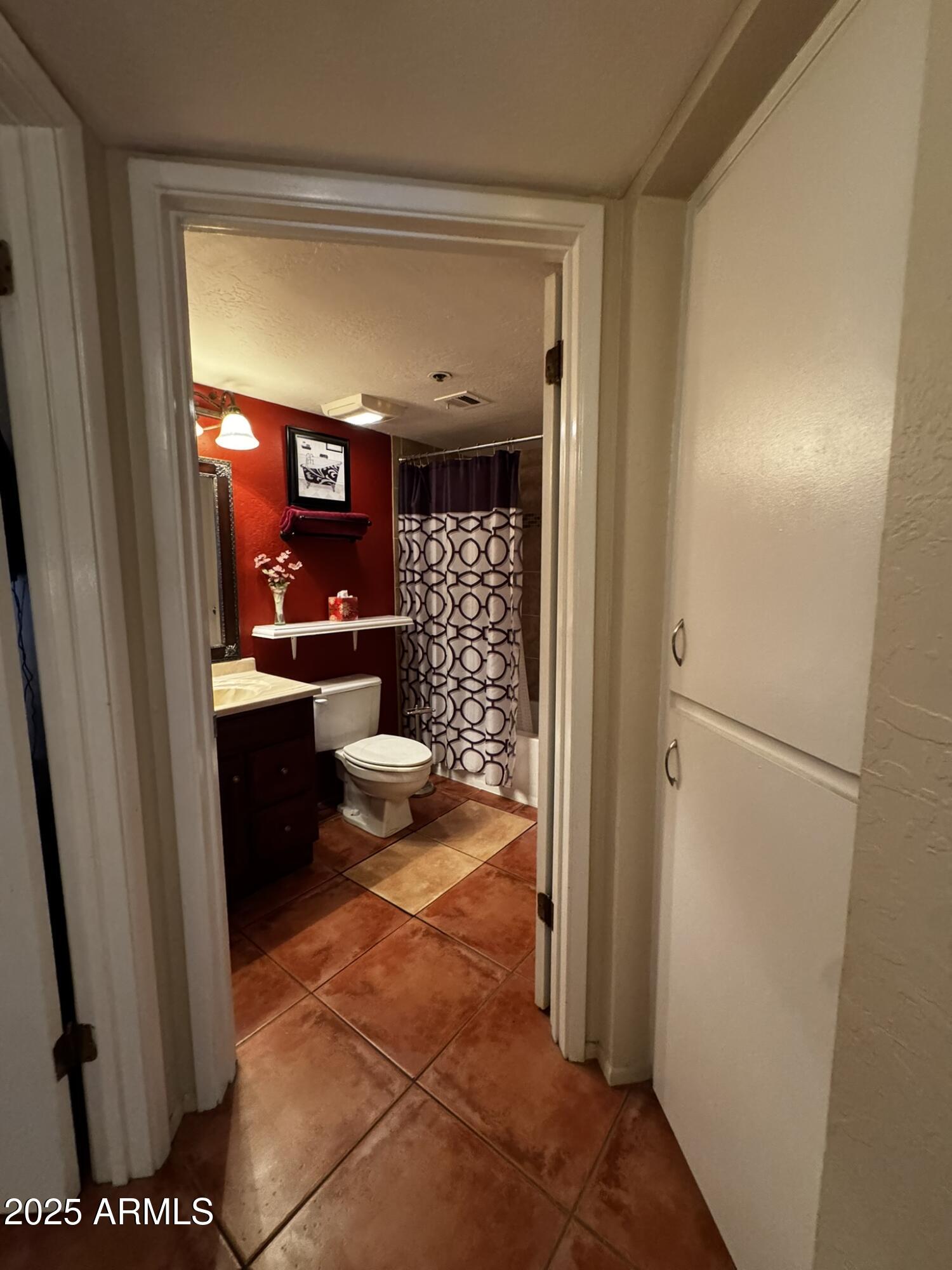 12123 West Bell Road, Unit 337 Surprise, AZ 85378 - Photo 26 of 50 a view of a hallway and a livingroom with furniture