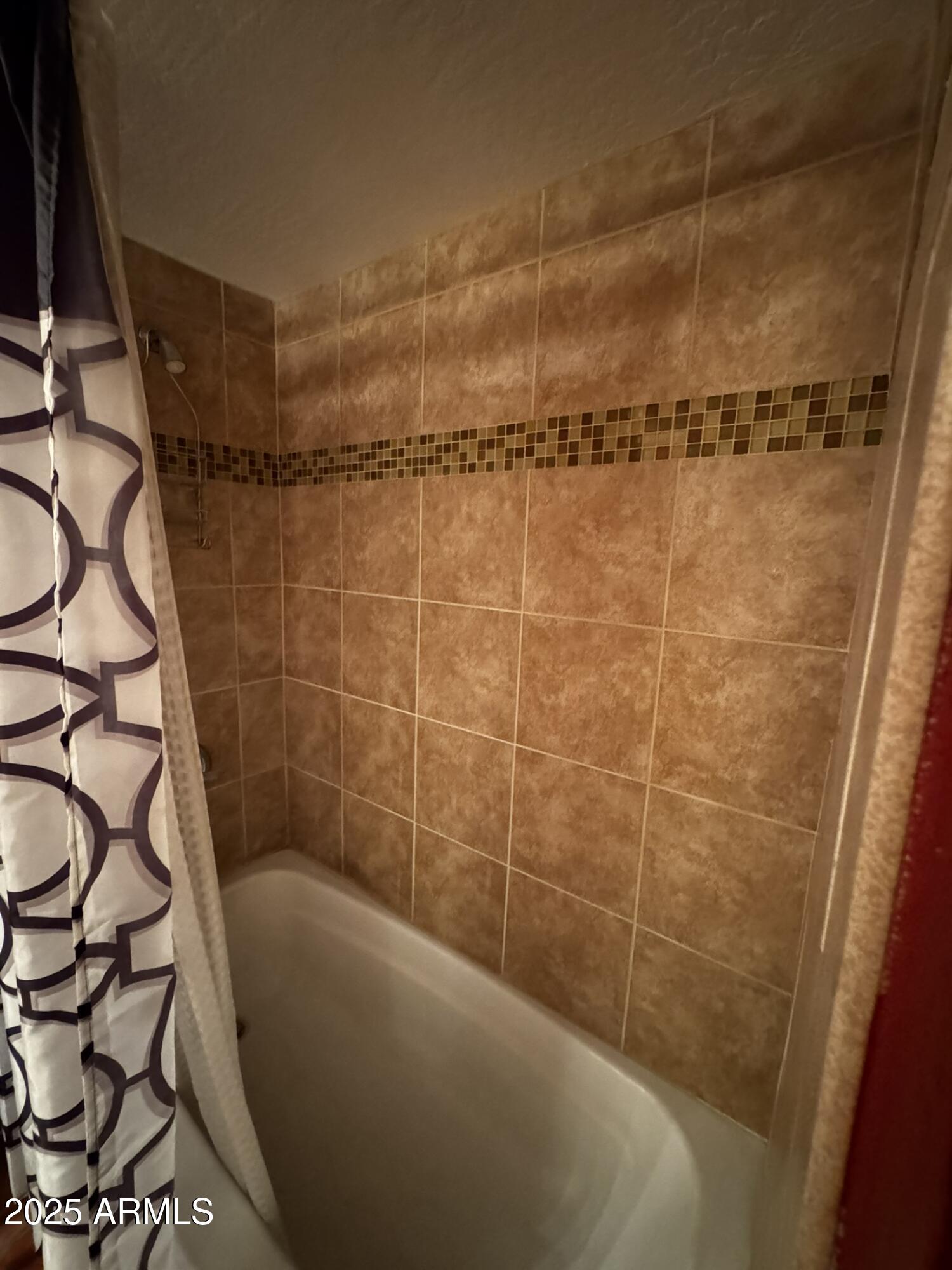 12123 West Bell Road, Unit 337 Surprise, AZ 85378 - Photo 28 of 50 a bathroom with a shower and a bathtub