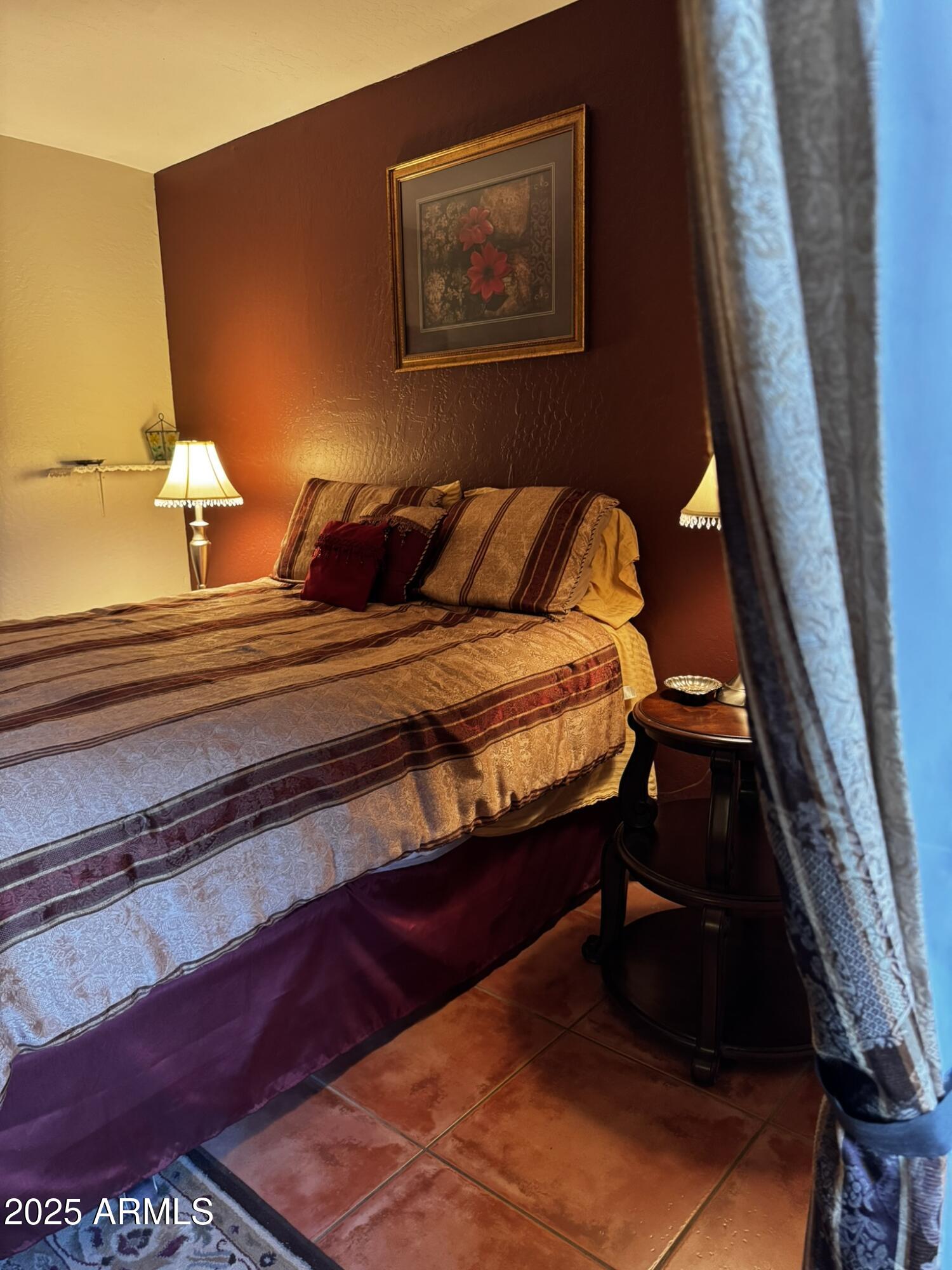 12123 West Bell Road, Unit 337 Surprise, AZ 85378 - Photo 39 of 50 a bedroom with bed and window