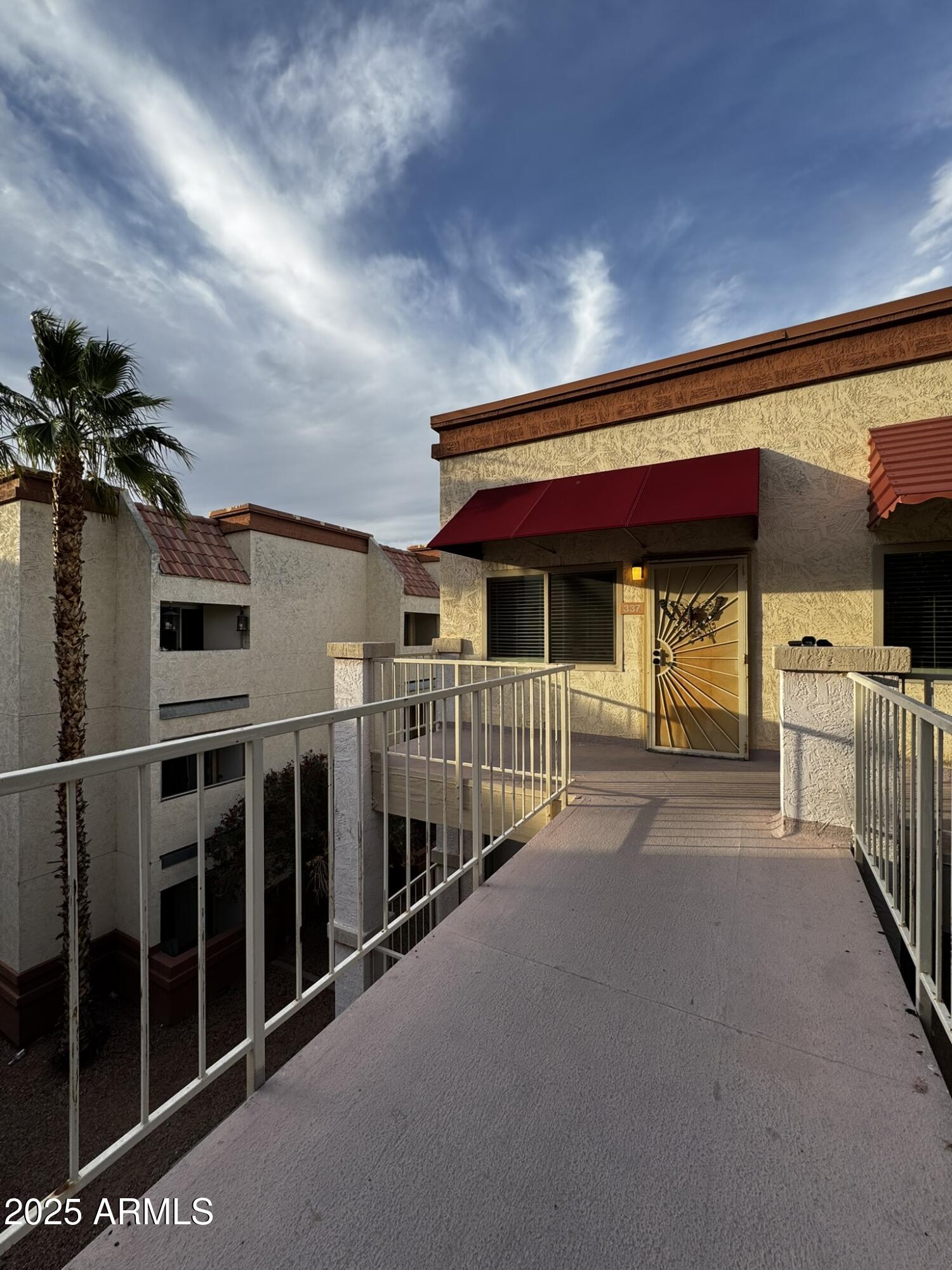 12123 West Bell Road, Unit 337 Surprise, AZ 85378 - Photo 44 of 50 a view of a chairs and table in the balcony
