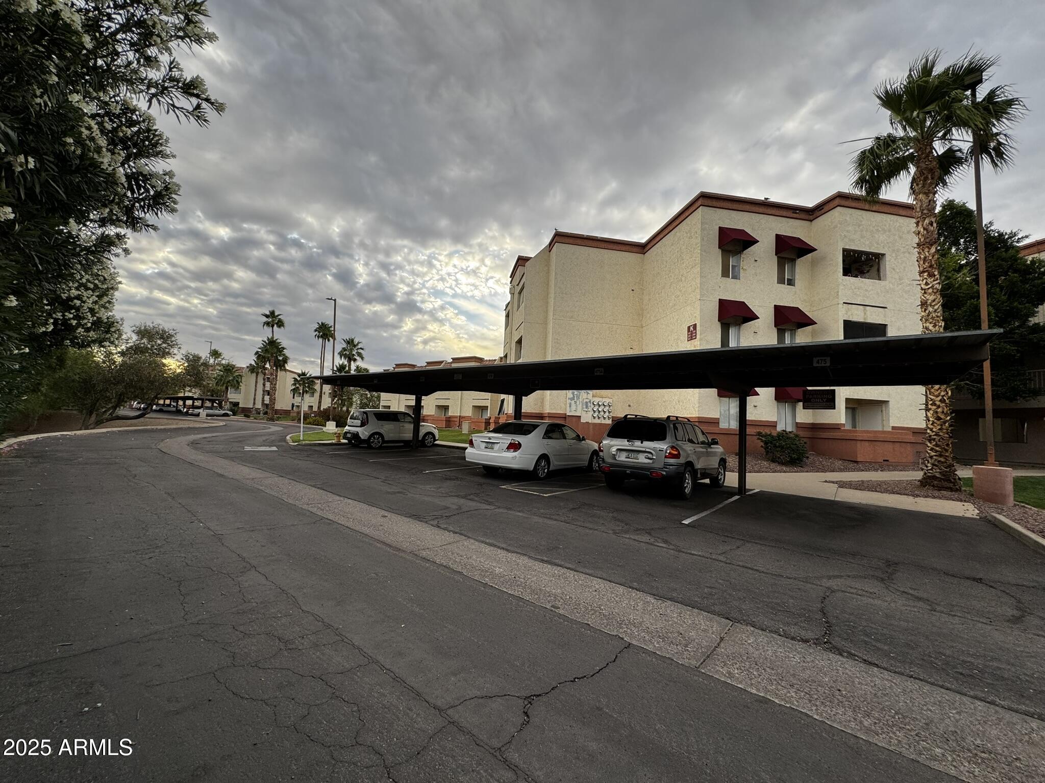 12123 West Bell Road, Unit 337 Surprise, AZ 85378 - Photo 45 of 50 a car parked in front of a house