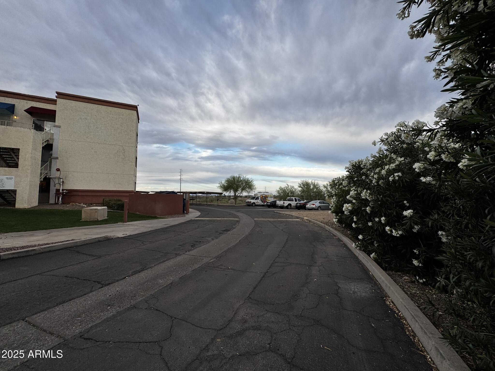 12123 West Bell Road, Unit 337 Surprise, AZ 85378 - Photo 47 of 50 a view of city street with a big yard