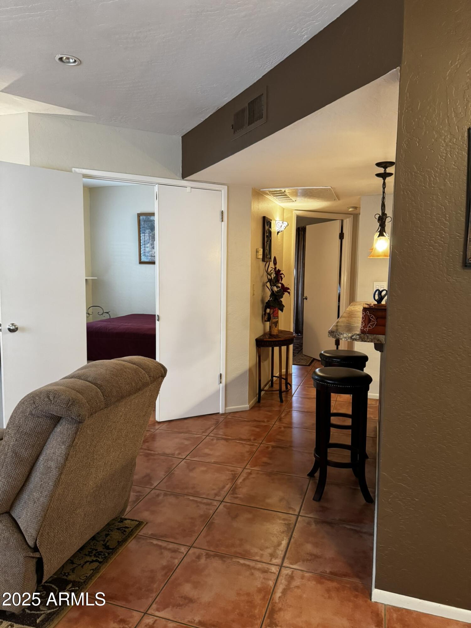 12123 West Bell Road, Unit 337 Surprise, AZ 85378 - Photo 7 of 50 a living room with furniture and a wooden floor