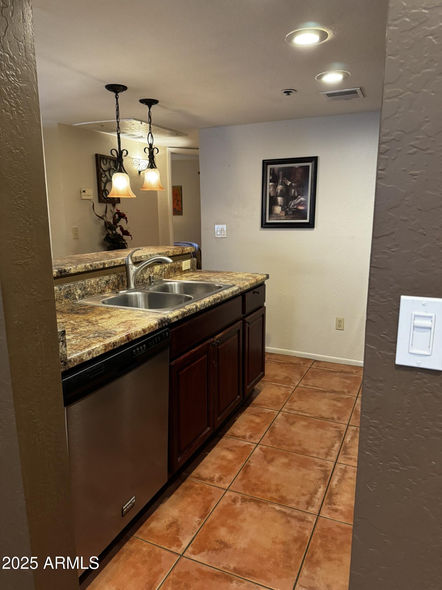 12123 West Bell Road, Unit 337 Surprise, AZ 85378 - Photo 9 of 50 a bathroom with a sink and a mirror
