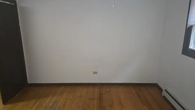 a kitchen with granite countertop a sink a stove and a refrigerator