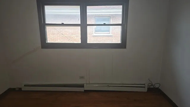 a kitchen with granite countertop a sink stove and cabinets
