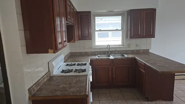 an empty room that has a window in it