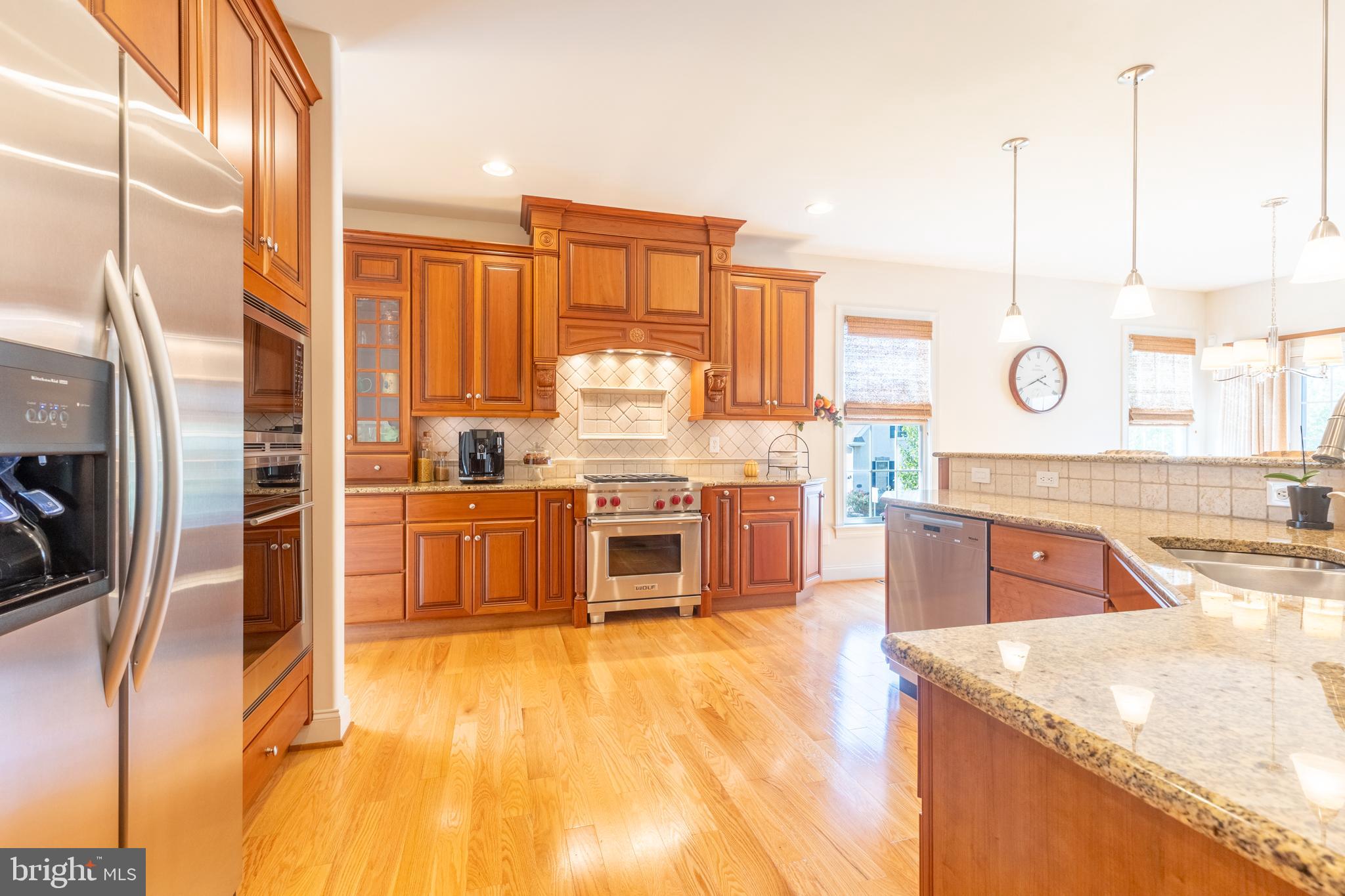101 Cornwall Road, Unit 116 Landenberg, PA 19350 - Photo 11 of 30 a kitchen with stainless steel appliances granite countertop a stove a sink and a refrigerator