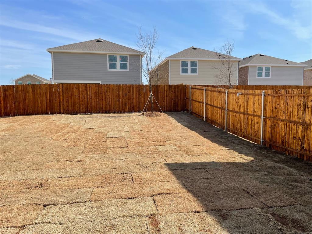 1911 Chapel Hill Road Princeton, TX 75407 - Photo 13 of 14 a view of wooden house with wooden fence