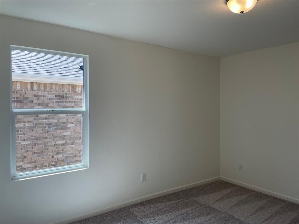 1911 Chapel Hill Road Princeton, TX 75407 - Photo 3 of 14 an empty room with a window