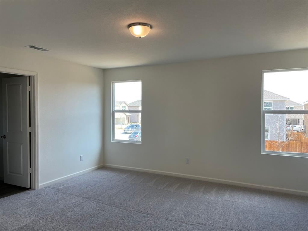 1911 Chapel Hill Road Princeton, TX 75407 - Photo 4 of 14 an empty room with windows