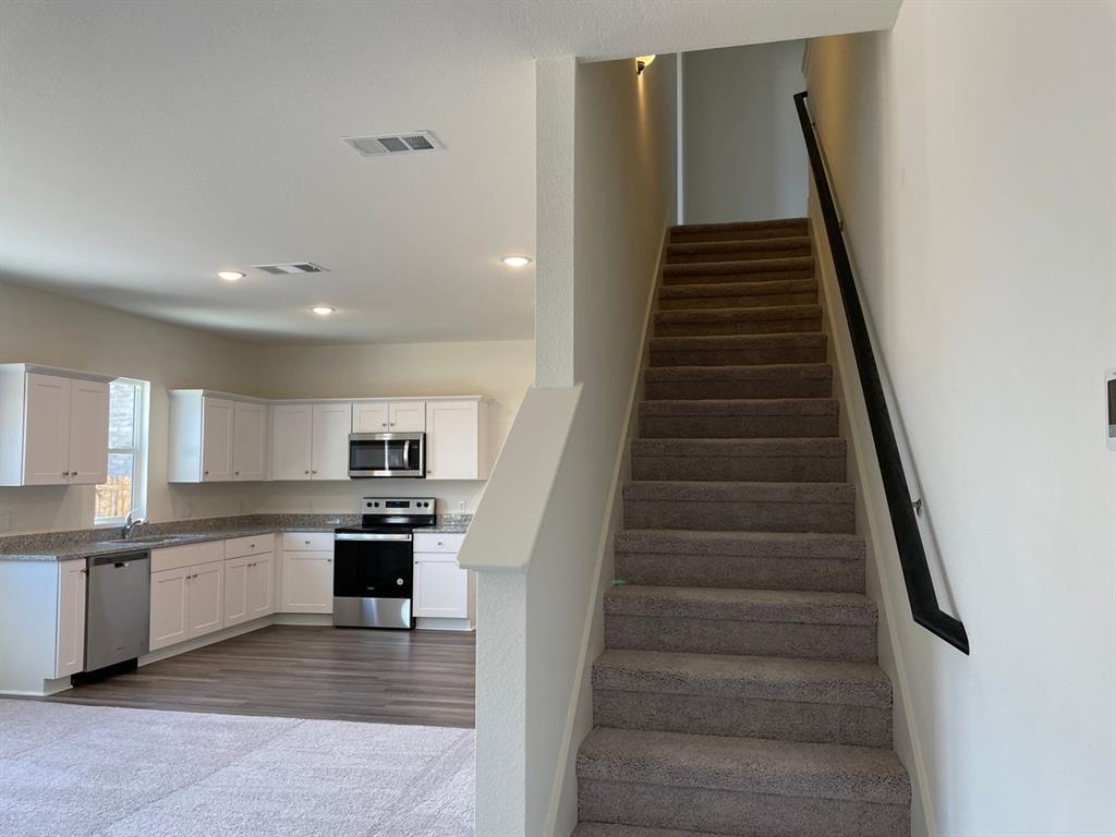 1911 Chapel Hill Road Princeton, TX 75407 - Photo 5 of 14 a view of kitchen with sink microwave and cabinets