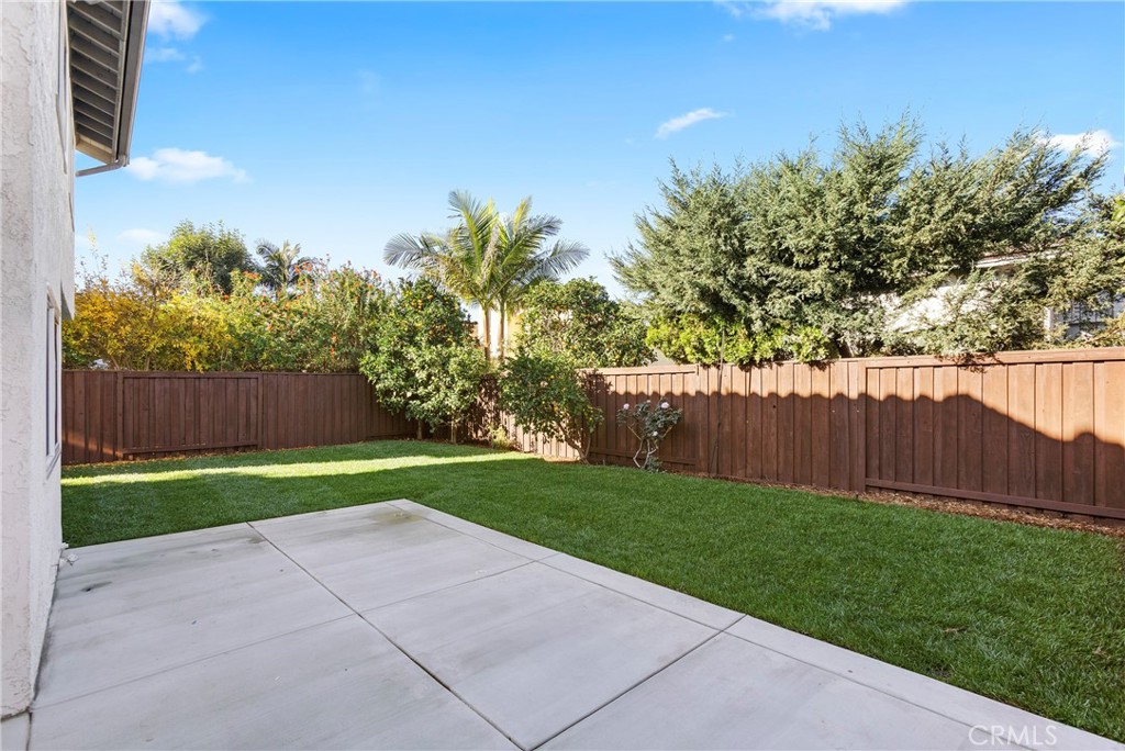 7 Chattanooga Irvine, CA 92620 - Photo 20 of 24 a view of a backyard with large trees and wooden fence