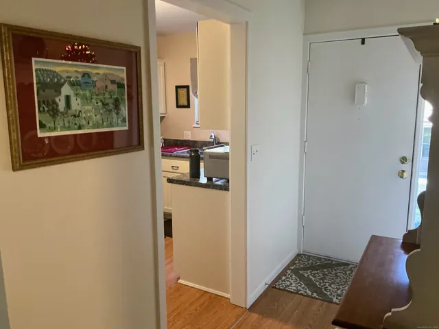 a kitchen with a stove and a white cabinets