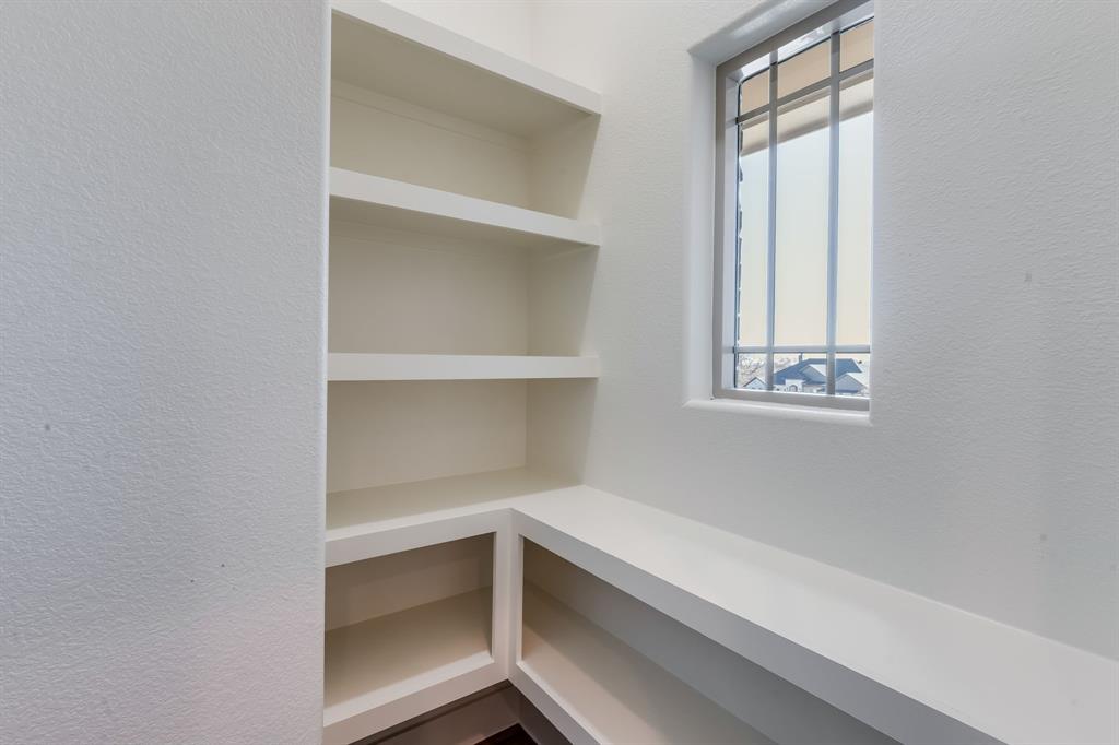7017 Rnch Vw Place Springtown, TX 76082 - Photo 14 of 38 a storage room with empty racks