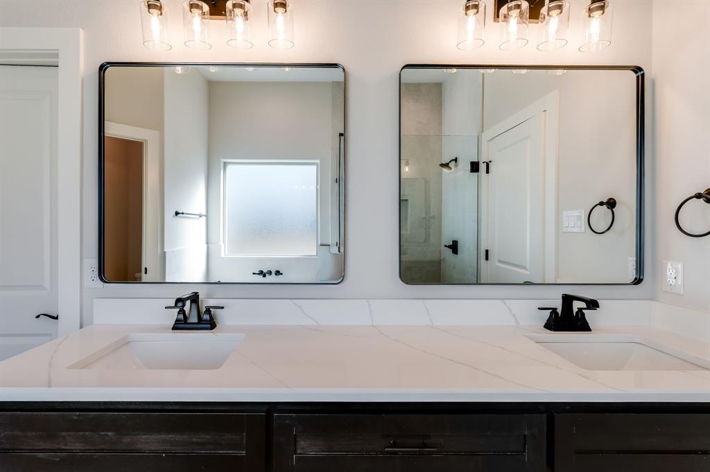 7017 Rnch Vw Place Springtown, TX 76082 - Photo 18 of 38 a bathroom with a sink and a mirror