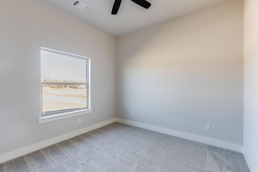 7017 Rnch Vw Place Springtown, TX 76082 - Photo 27 of 38 an empty room with a window