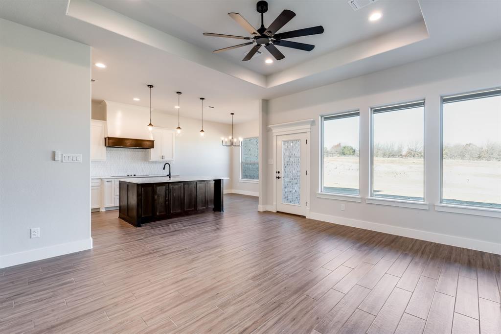 7017 Rnch Vw Place Springtown, TX 76082 - Photo 7 of 38 a view of kitchen with sink and wooden floor