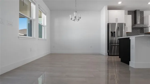a view of a kitchen with a refrigerator a microwave and a refrigerator