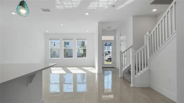 a view of an entryway with wooden floor