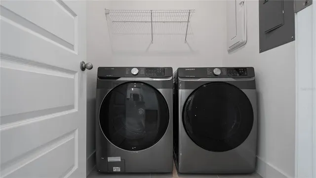 a utility room with dryer and washer