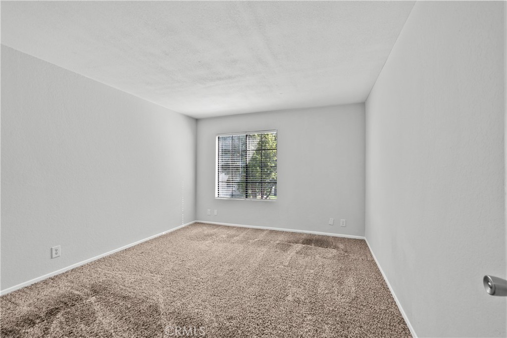 2554 Olive Drive, Unit 116 Palmdale, CA 93550 - Photo 19 of 26 an empty room with a window