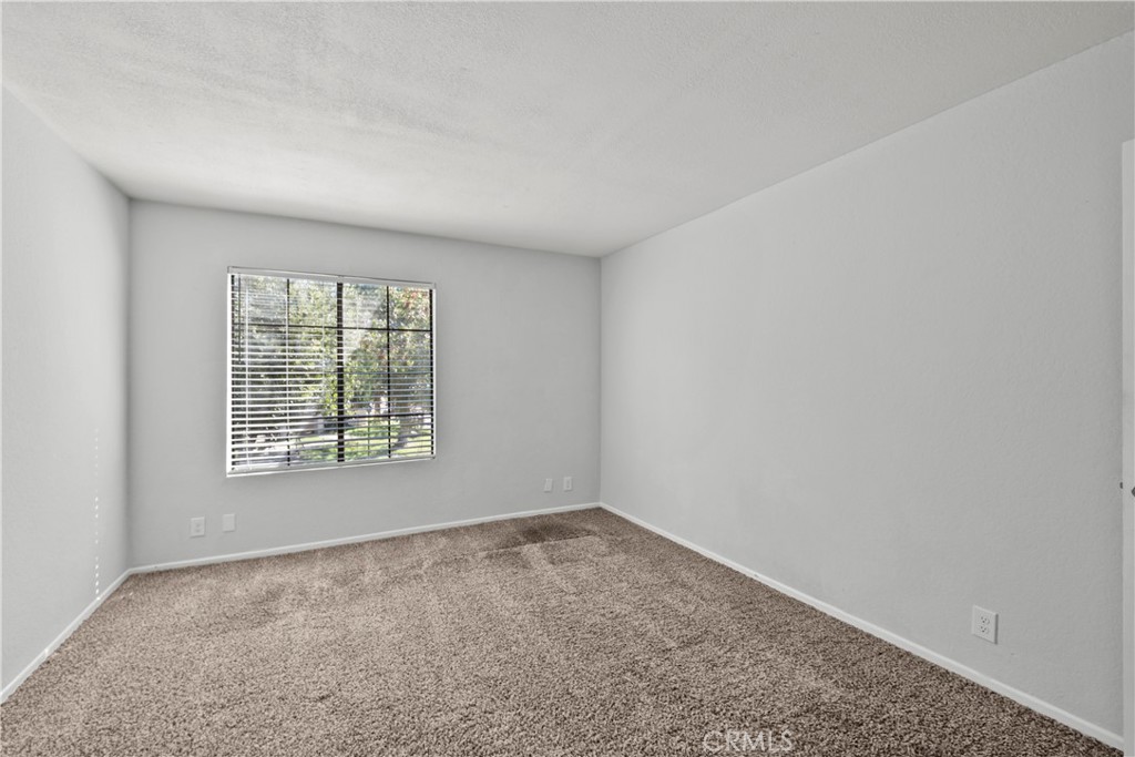 2554 Olive Drive, Unit 116 Palmdale, CA 93550 - Photo 21 of 26 an empty room with a window