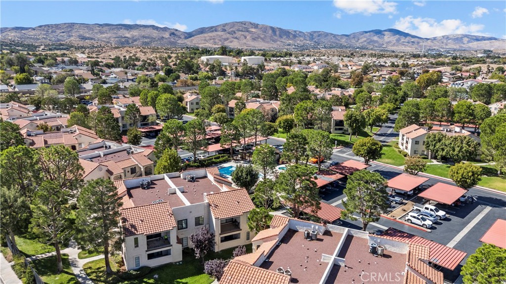 2554 Olive Drive, Unit 116 Palmdale, CA 93550 - Photo 25 of 26 an aerial view of residential houses with outdoor space