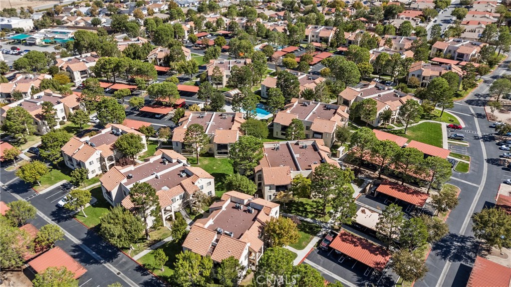 2554 Olive Drive, Unit 116 Palmdale, CA 93550 - Photo 26 of 26 an aerial view of residential houses with outdoor space and parking