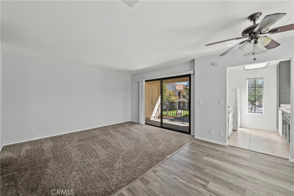 2554 Olive Drive, Unit 116 Palmdale, CA 93550 - Photo 5 of 26 wooden floor in an empty room with a window