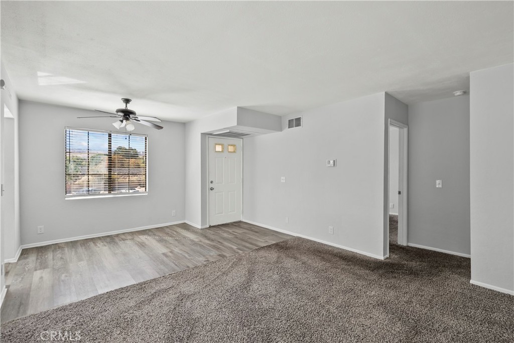 2554 Olive Drive, Unit 116 Palmdale, CA 93550 - Photo 7 of 26 an empty room with windows and cabinet
