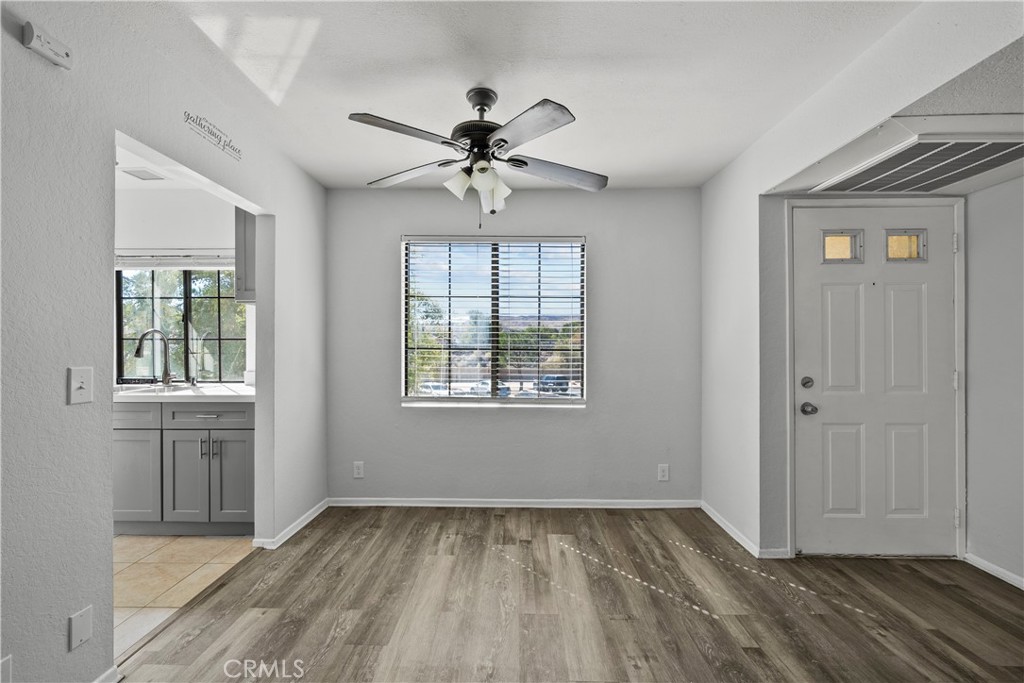 2554 Olive Drive, Unit 116 Palmdale, CA 93550 - Photo 8 of 26 wooden floor in an empty room with a window