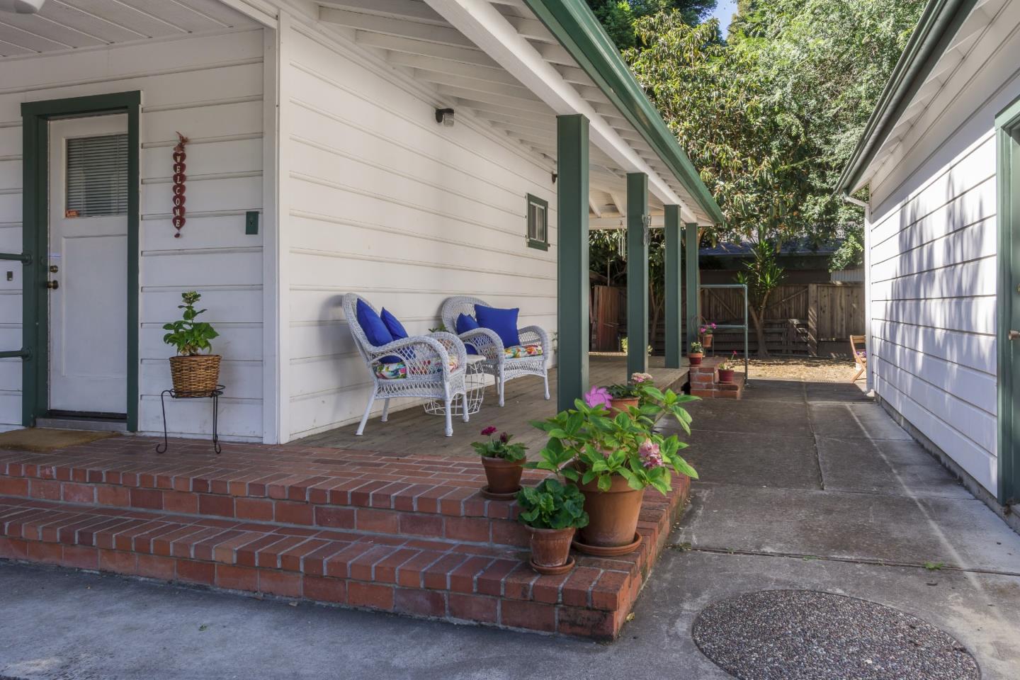 91 Marsh Road Atherton, CA 94027 - Photo 18 of 20 a wooden bench sitting in front of a building